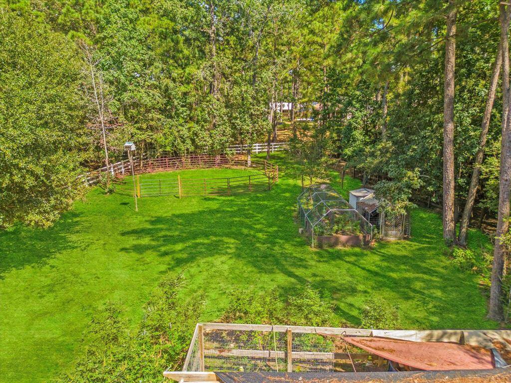 View from upstairs overlooking the backyard and covered garden.