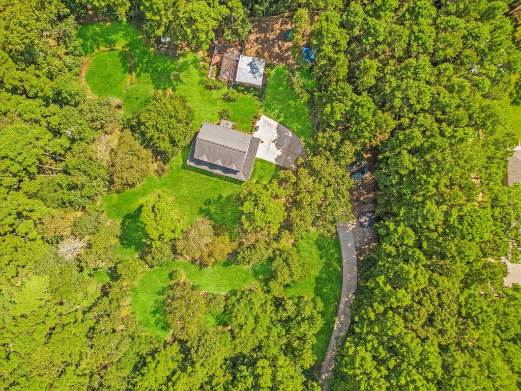 Aerial view of this beatiful, wooded property.