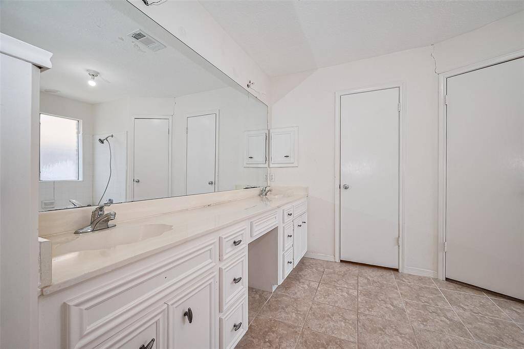 Ensuite bathroom in primary. Light fixtures are in the boxes ready for you to install.