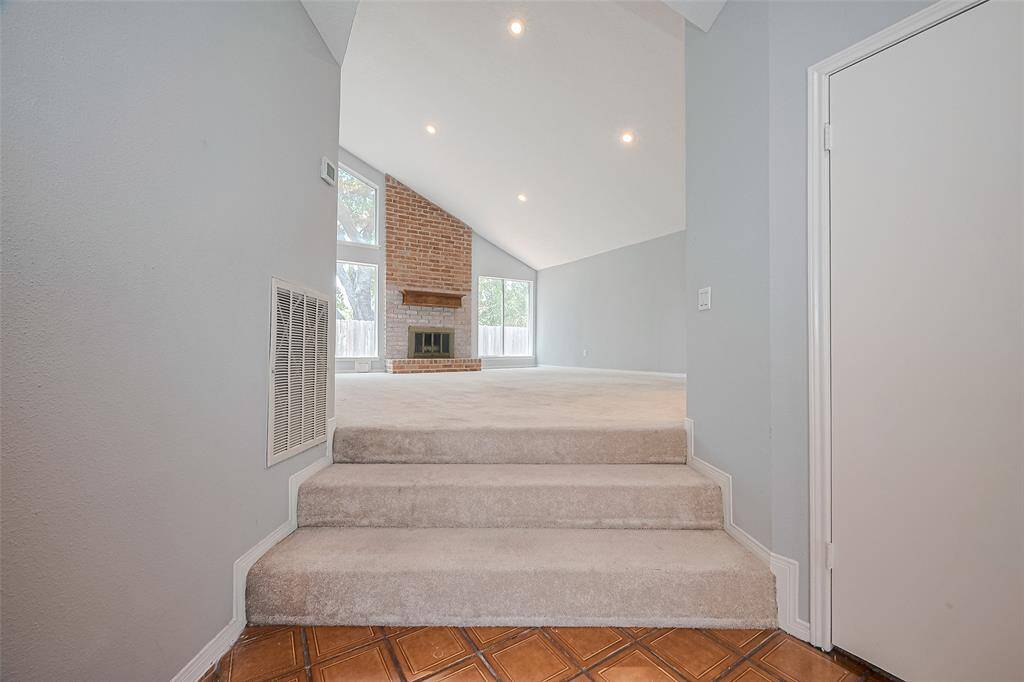 Step up into a large, light & bright living area.