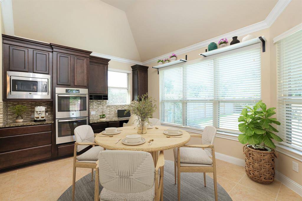 This end of the kitchen offers a data desk area and breakfast nook