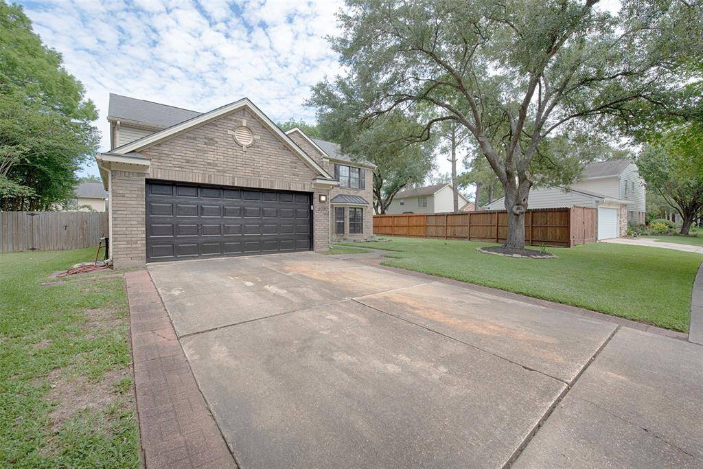 Paved brick on both sides of the driveway to the garage. Great additional parking for your guests.
