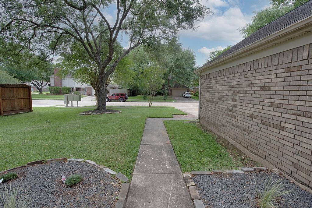 A view from the the front porch of the front yard. The community mail box is conveniently located at the end of your new yard.