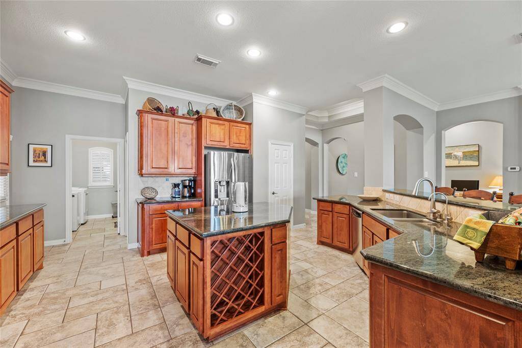 Alternate view of the kitchen island with built-in wine rack.