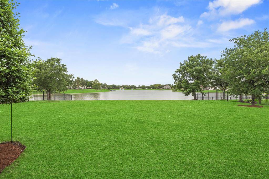Center view of the rear yard towards the lake.  What a view!