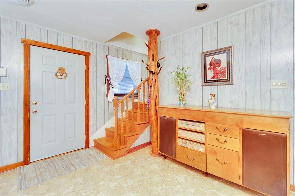 Front door and stairs to 2nd level.