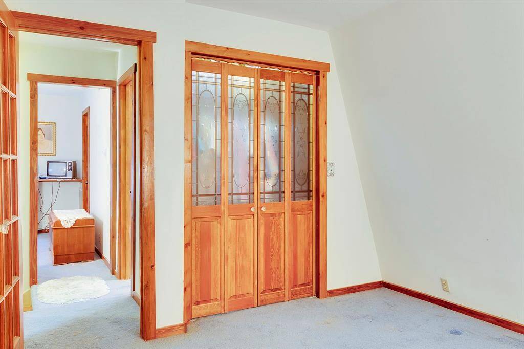 2nd Bedroom with custom closet doors all closet in home have cedar lined.