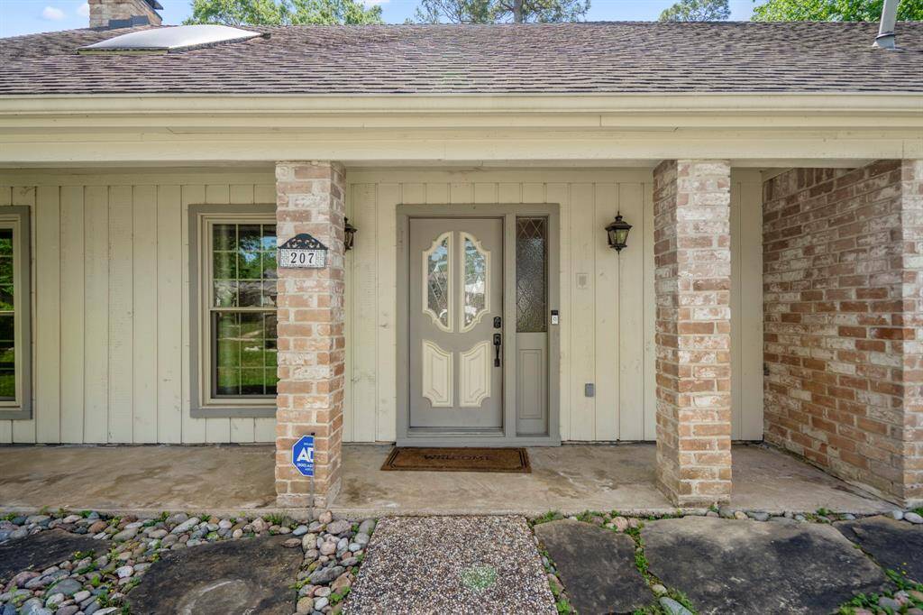 A beautiful covered front patio is perfect for outdoor furniture where you can have your morning coffee before you begin your day.