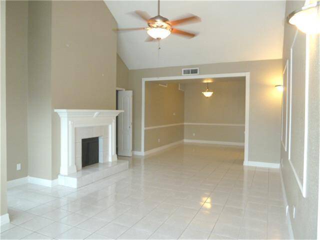 Large Living Space features cathedral ceiling & Wood Burning Fireplace