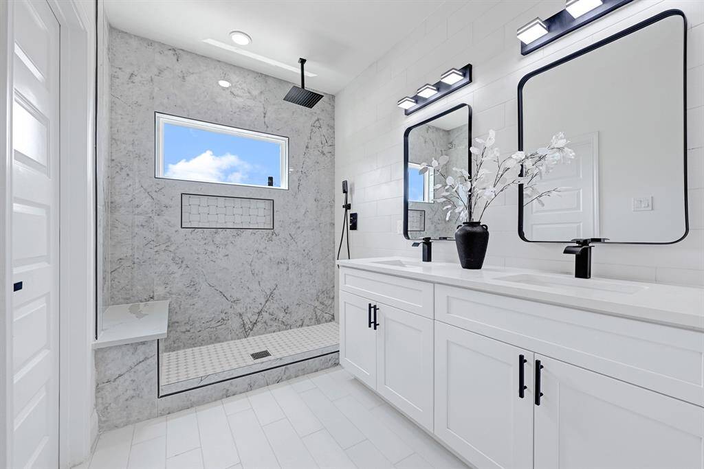 Experience luxury with this elegant walk-in shower, featuring sleek design and modern finishes.