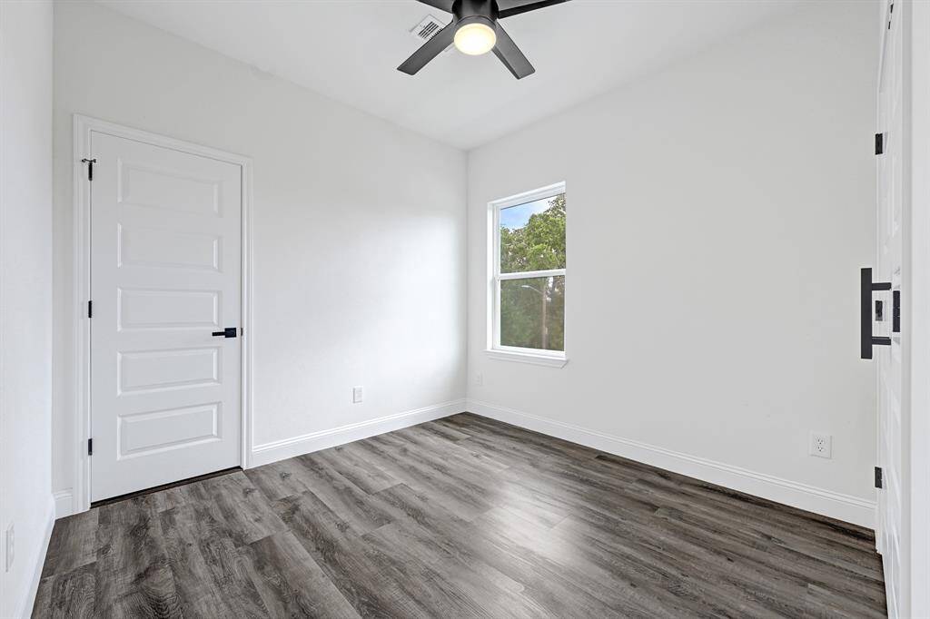Bright, airy room with elegant wood flooring.