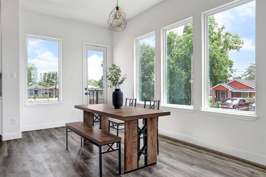 Bright dining room with expansive windows offering abundant natural light.