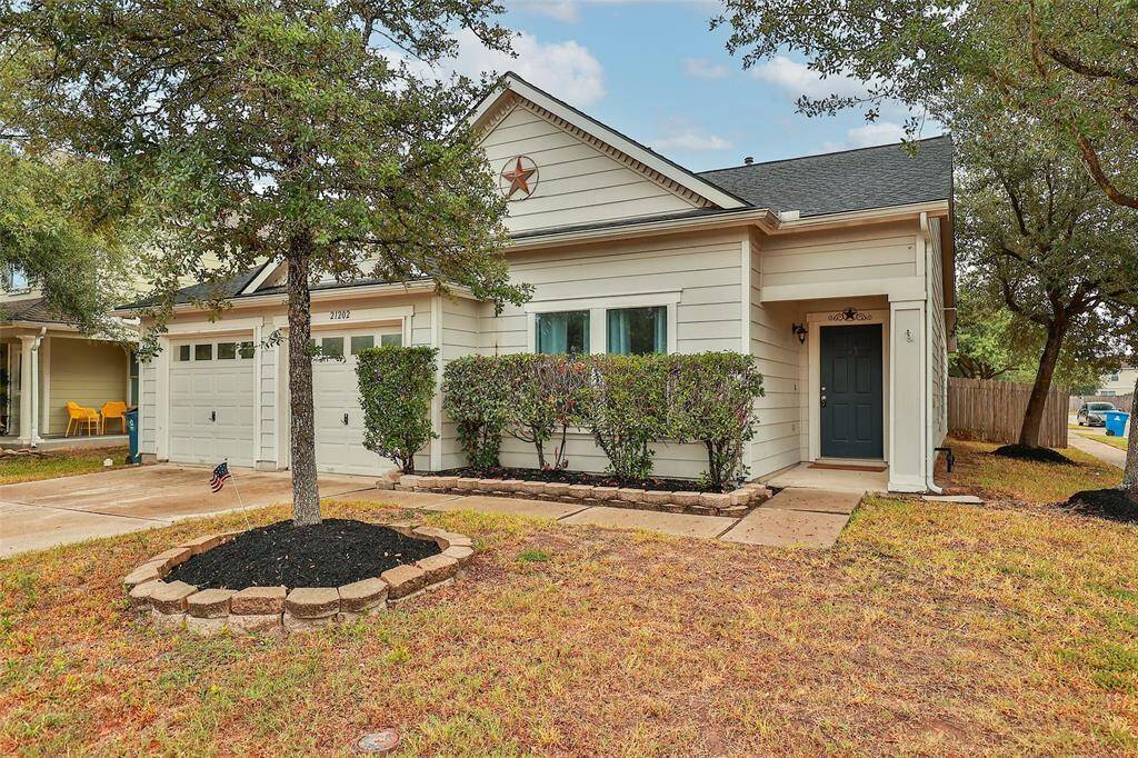 Charming Curb Appeal. Well-maintained single-story home with a classic brick exterior and a neatly landscaped front yard.