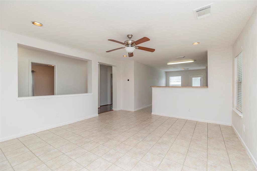 Bright Living Room. Spacious living area featuring large windows that fill the space with natural light.