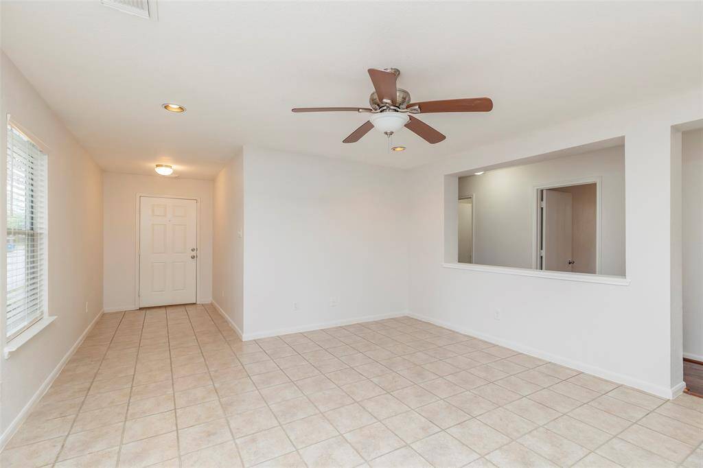 Bright Living Room. Spacious living area featuring large windows that fill the space with natural light.