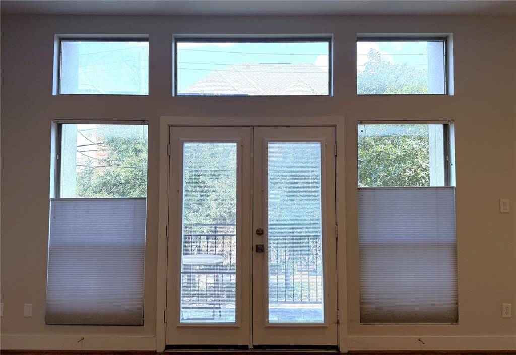 Top-down, bottom- up blinds. The French doors offer internal blinds.