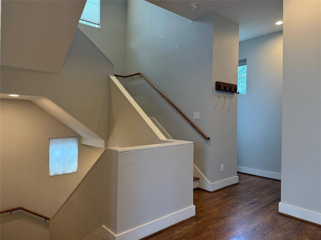 Immediately near to the stairs, on the far right, is the tucked away 1/2 bath.