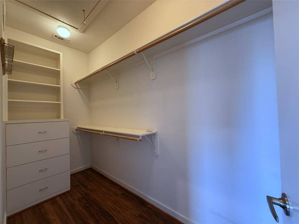 The walk-in closet offers built-in drawers/shelving.