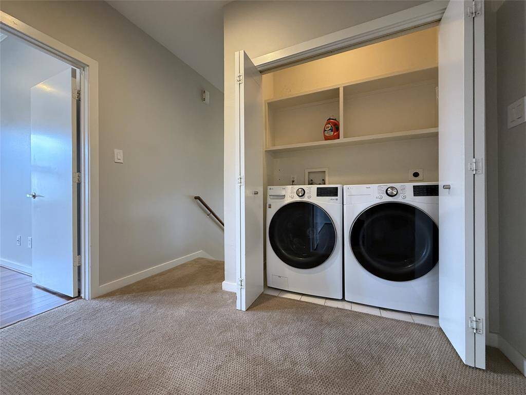 The laundry room is conveniently located in the 3rd floor hallway near to the primary suite and 3rd bedroom.
