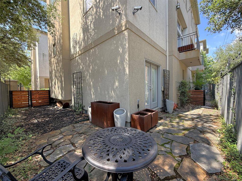 The wrap around outdoor space offers garden containers for plants & herbs.