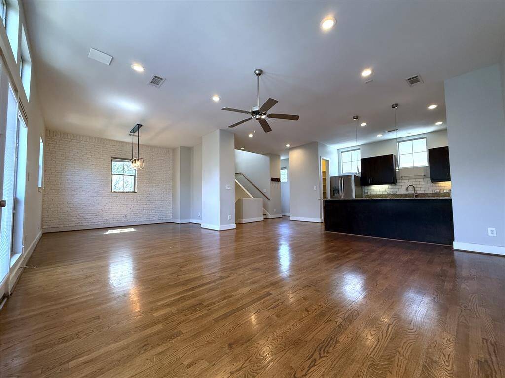 On the second floor, the main living space, with ceiling fan & recessed lighting, is spacious! Perfect for entertaining.