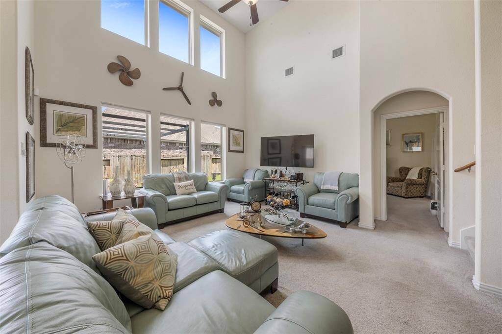 Another angle of the cozy living area with a view of the principal bedroom and a view of the hidden staircase.