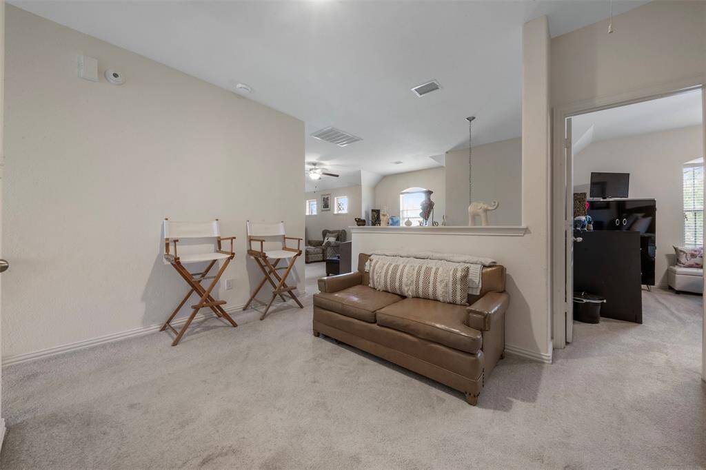 Upstairs landing are with a view of one of the spacious secondary bedrooms to the right.