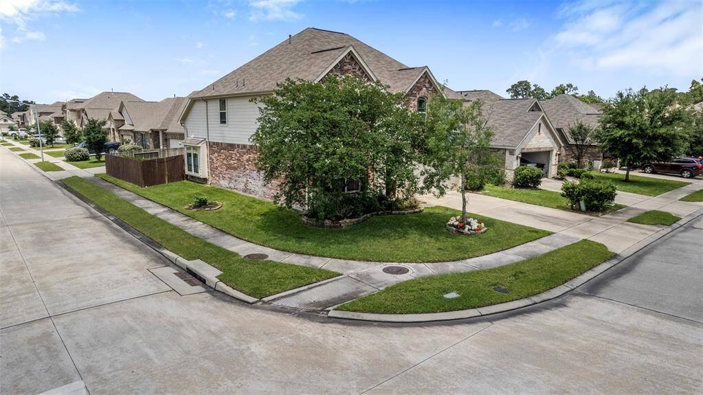 Aerial view of the home situated on a corner lot.