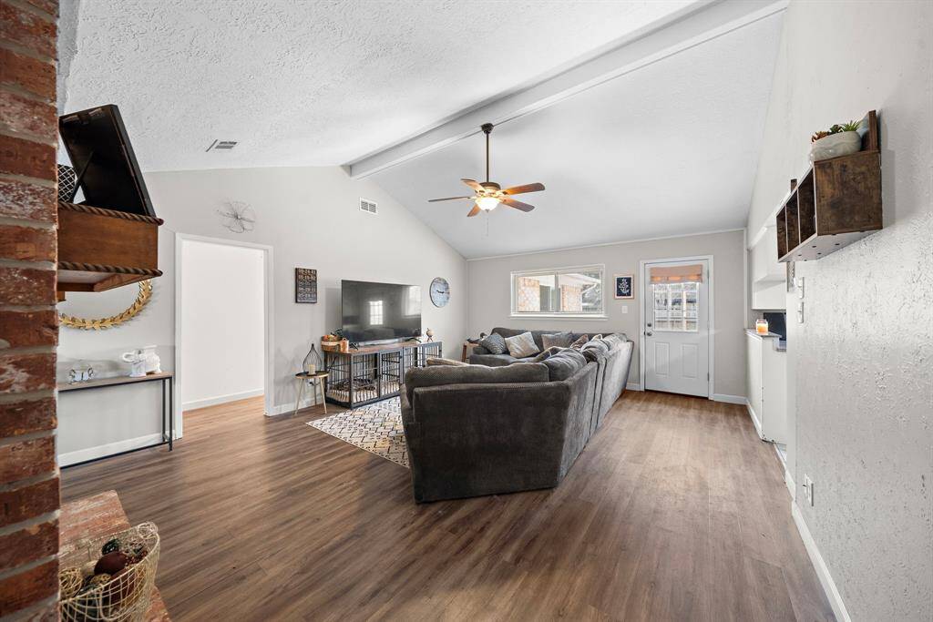 Bright and inviting living room with direct access to the backyard.