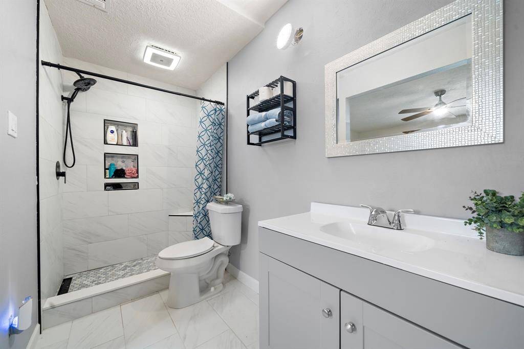 Elegant, newly renovated primary ensuite with a spacious shower.