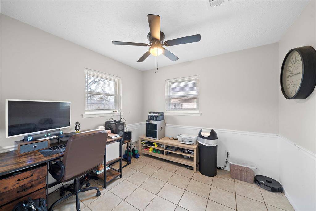 Cozy dining area off the kitchen, currently styled as a versatile office space.