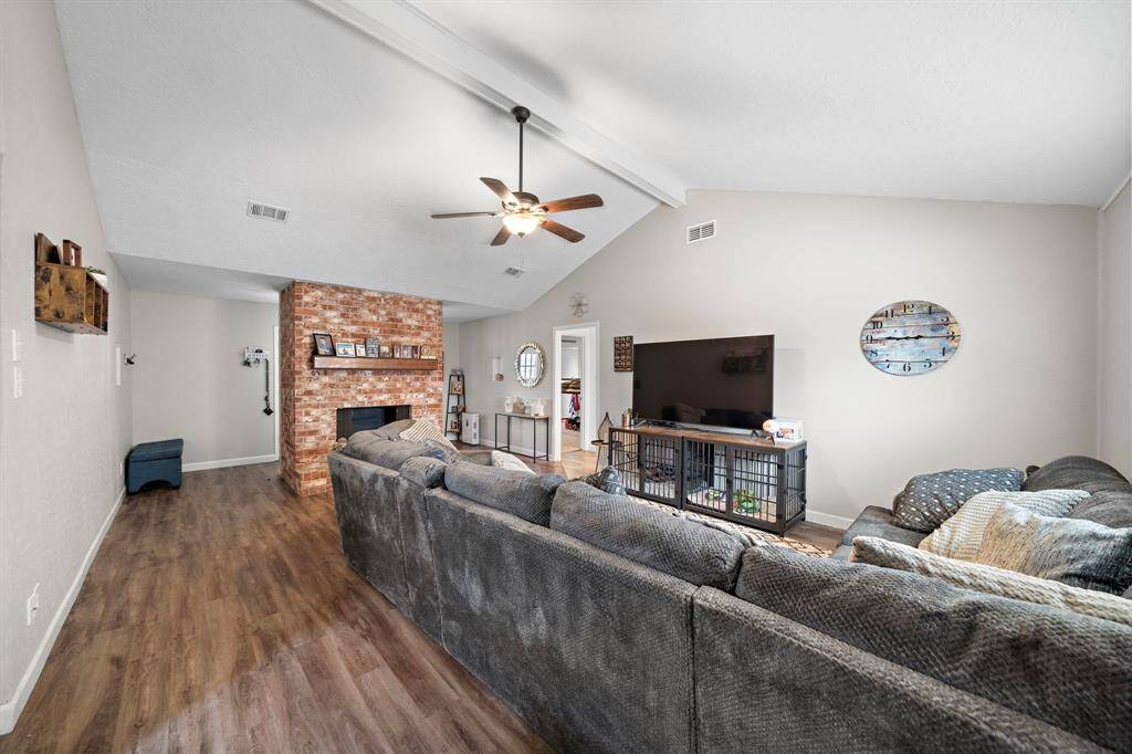 Expansive living room with vaulted ceilings and soothing neutral tones.
