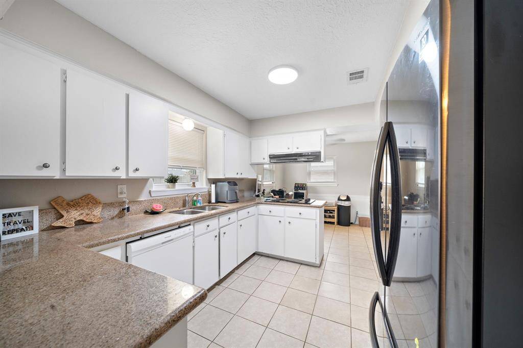 Expansive kitchen with generous counter space.