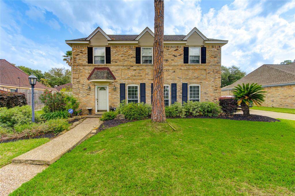 With a welcoming path and beautifully manicured landscaping, this home has classic curb appeal