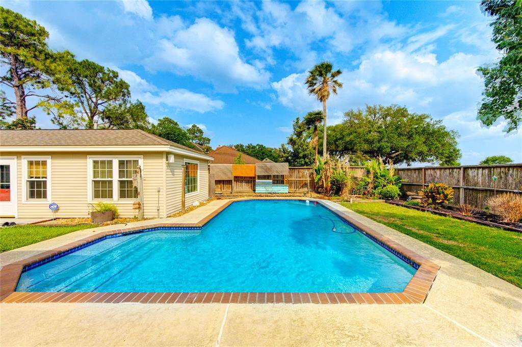 Enjoy resort-style living in your own backyard with this sparkling in-ground pool