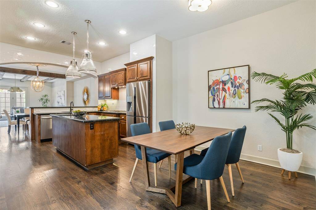 Perfectly positioned just off the kitchen, this cheerful breakfast nook keeps daily life effortless and connected. With room for casual meals, homework sessions, or morning coffee, it blends seamlessly into the heart of the home.