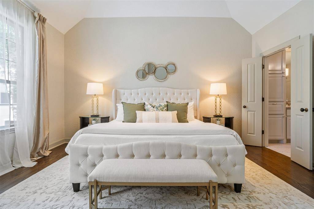A calming sanctuary awaits in the spacious primary suite, where vaulted ceilings, soft natural light, and elegant finishes create an atmosphere of quiet luxury. Whether you’re winding down or starting your day, this space offers the perfect balance of comfort and refinement.