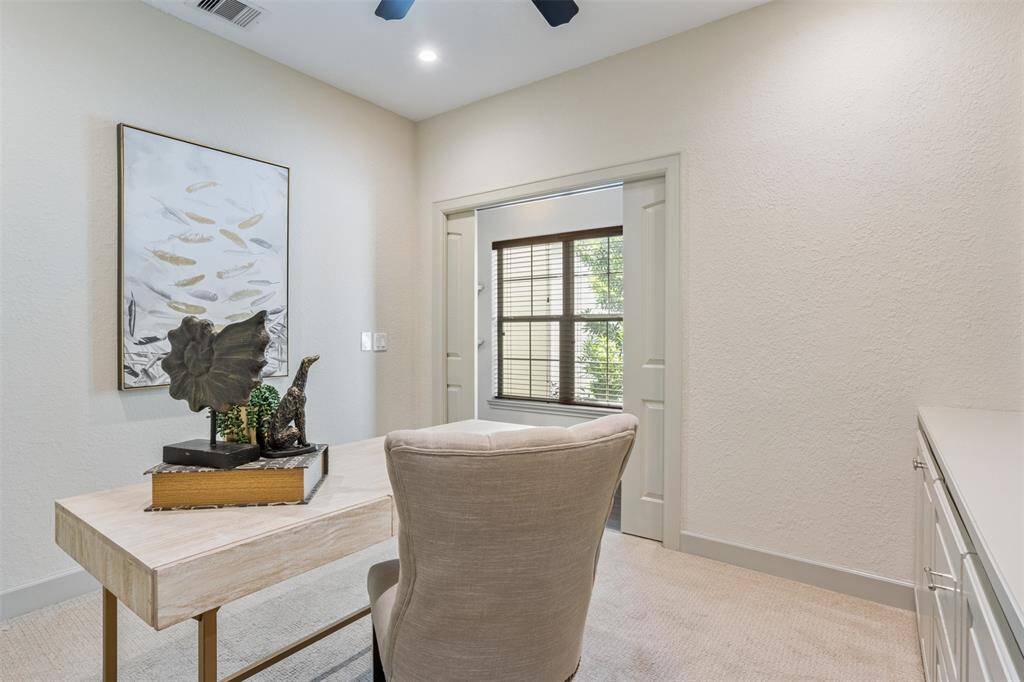Tucked just off the main hallway, the home office enjoys peaceful views of the front path and surrounding greenery—offering a bright, inspiring workspace with a sense of calm and connection to nature.
