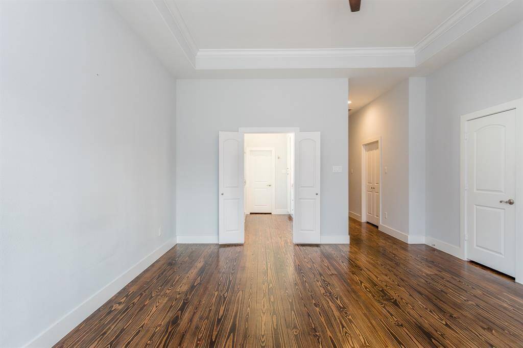 The primary suite boasts two his/her spacious walk-in closets, a private office or vanity area, and the double-door primary bath.*Tenant occupied until 05/31*.
