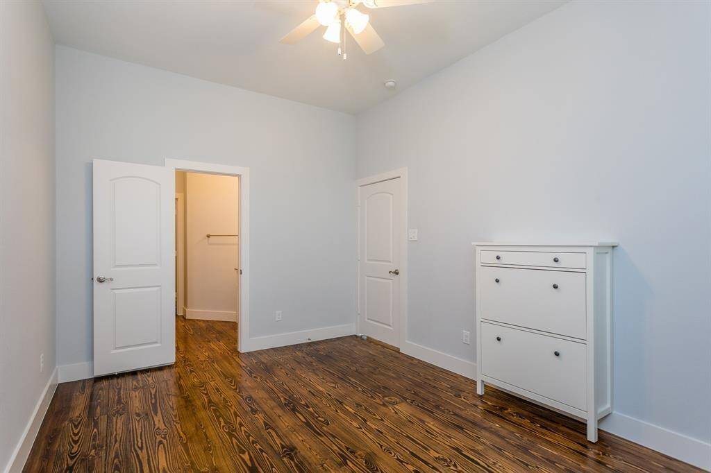 Another bedroom at the top of the stairs has an en-suit bath and huge walk-in closet attached. It feels like a private suite of its own in this room. *Tenant occupied until 05/31/25.*