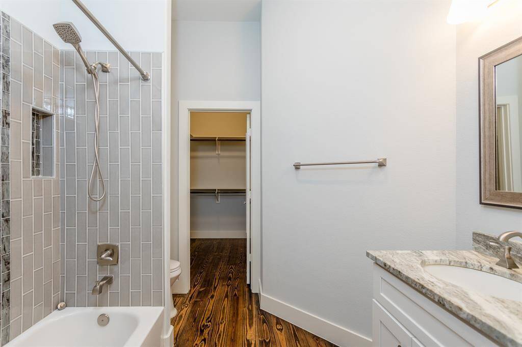 Attached bathroom and large walk-in closet.