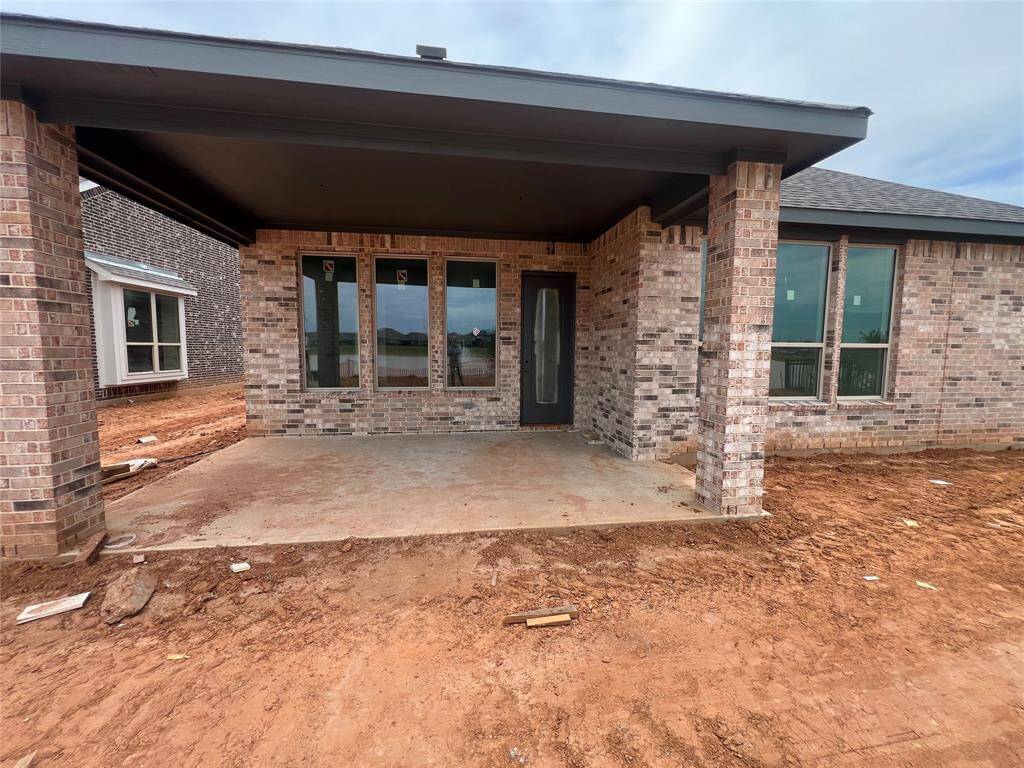 Large windows offer breathtaking views of the surrounding landscape, creating a backdrop that changes with the seasons and fills your home with warmth