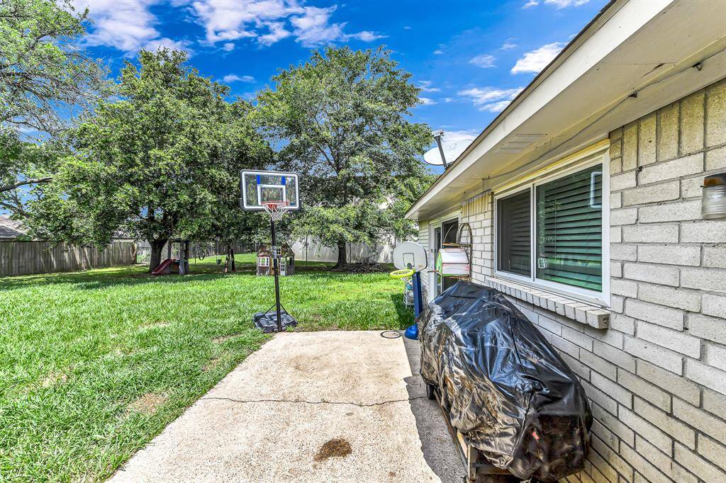 large back yard with patio
