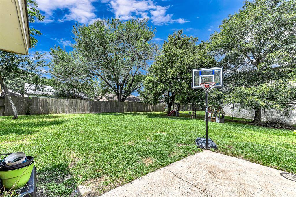 large back yard with patio