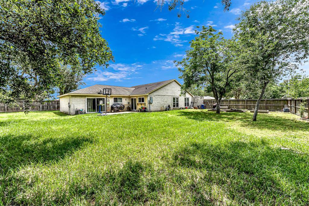 large back yard with patio