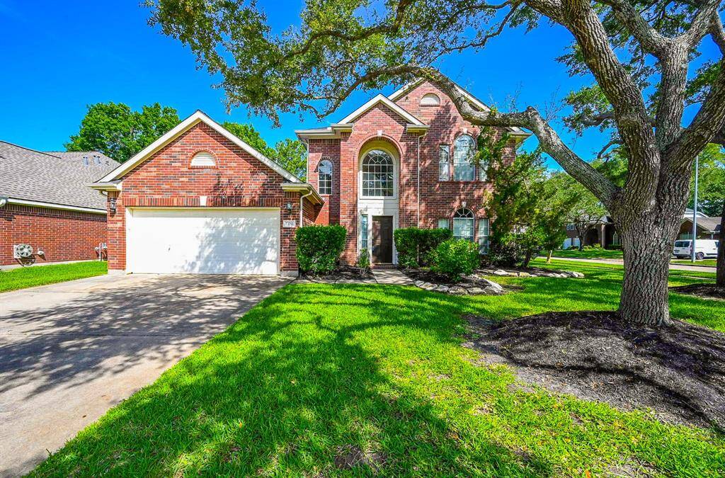 Beautiful corner home situated in the highly sought after Cinco Ranch neighborhood - zoned to award winning Katy ISD schools!