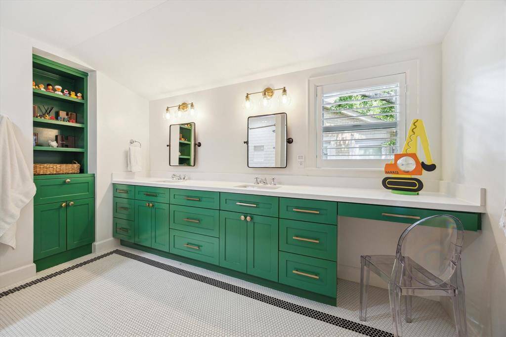Upstairs spacious bathroom with double sinks, vanity area and quartz counters