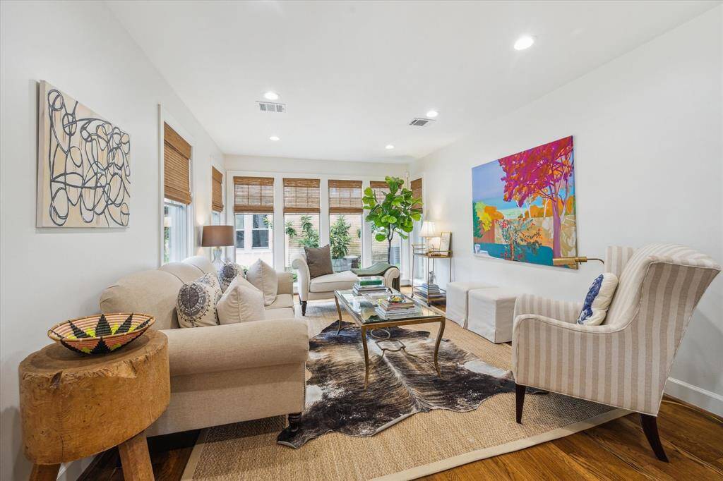 Upon entry you are greeted by the formal living with a wall of windows
