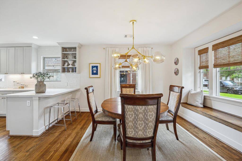 Dining room open to the kitchen with window seat