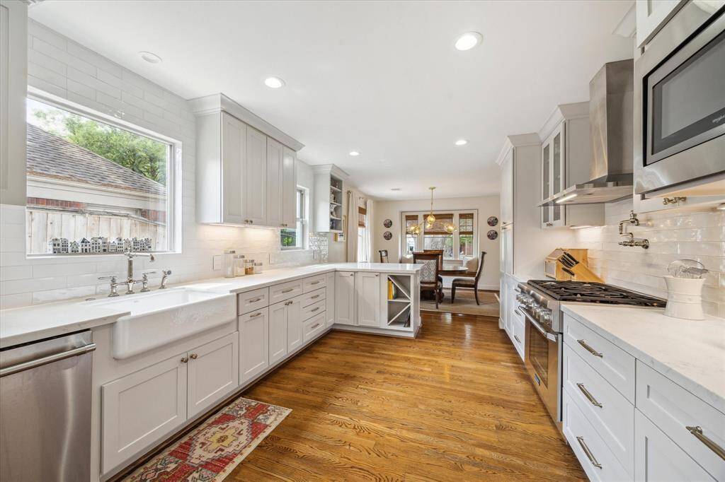 Fabulous kitchen with Thermador range and dishwasher, farm sink, quartz counters and more.